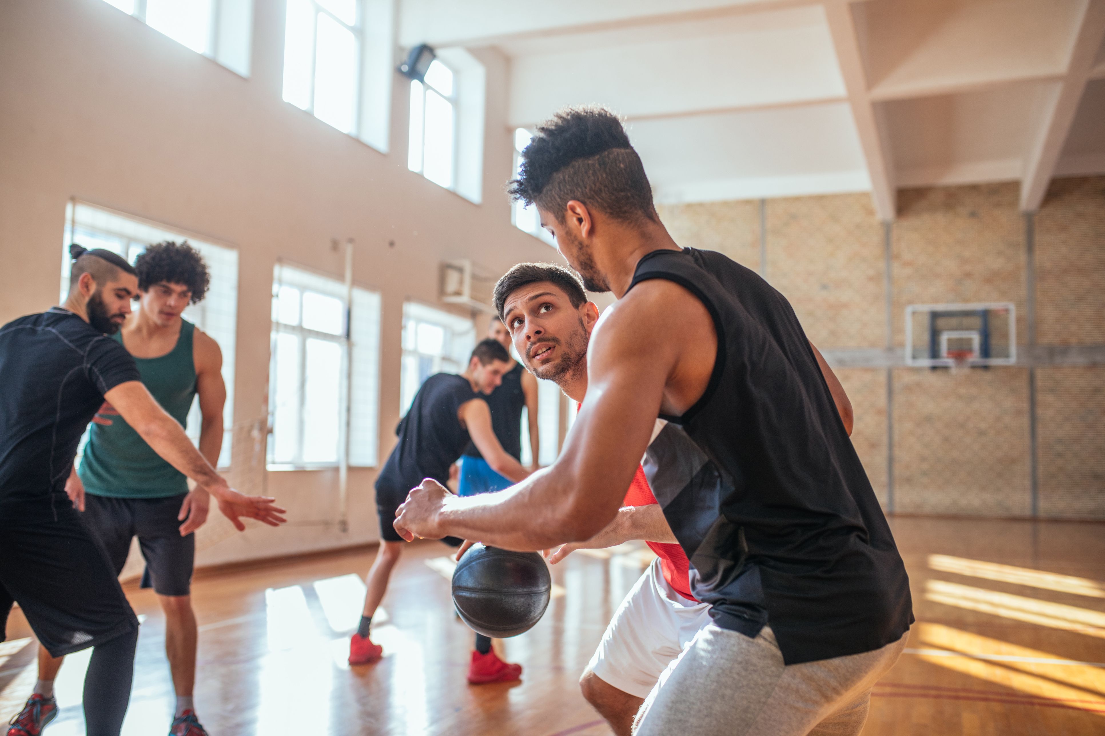 Men playing basketball
