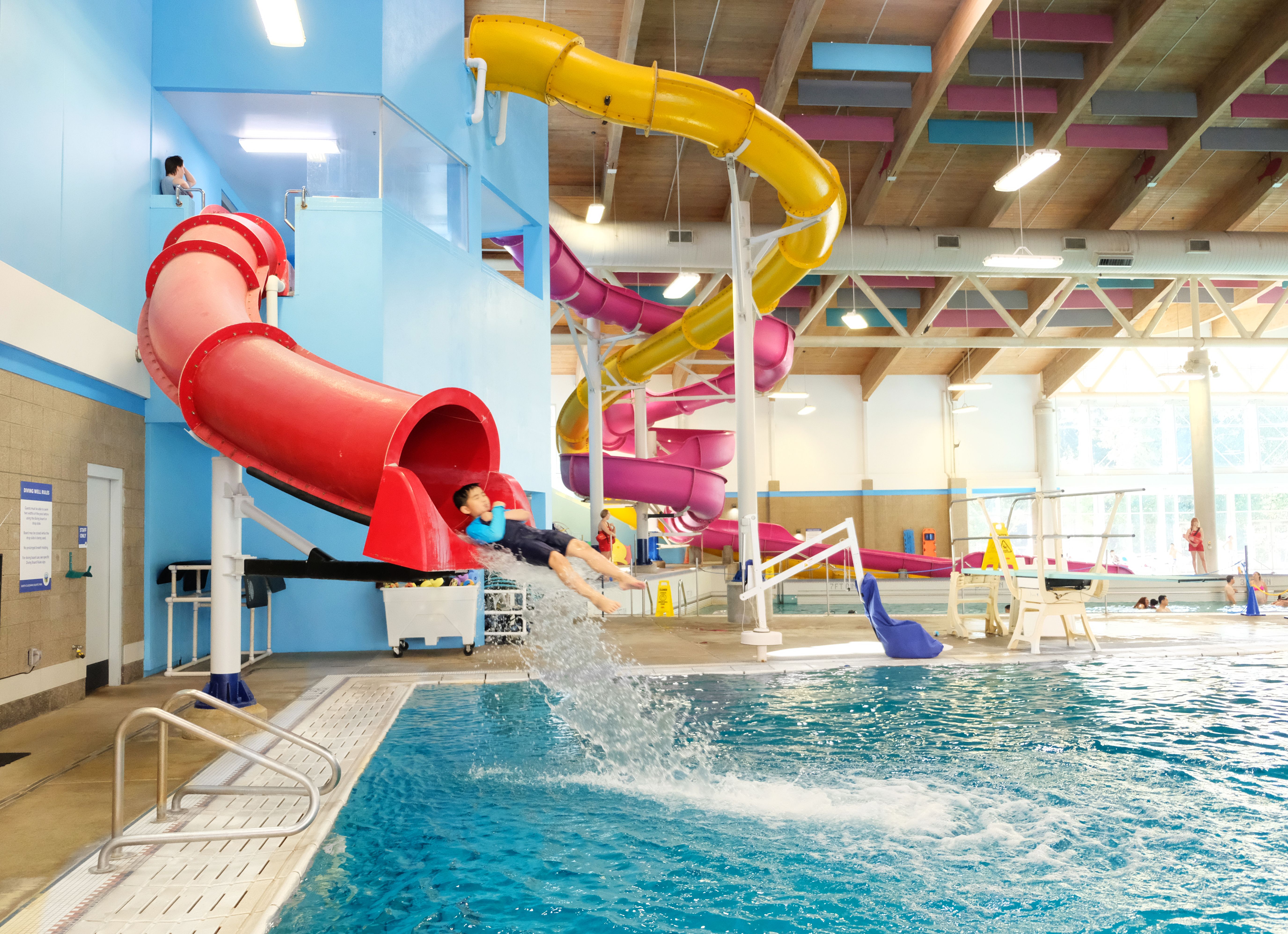 Kid going down water slide