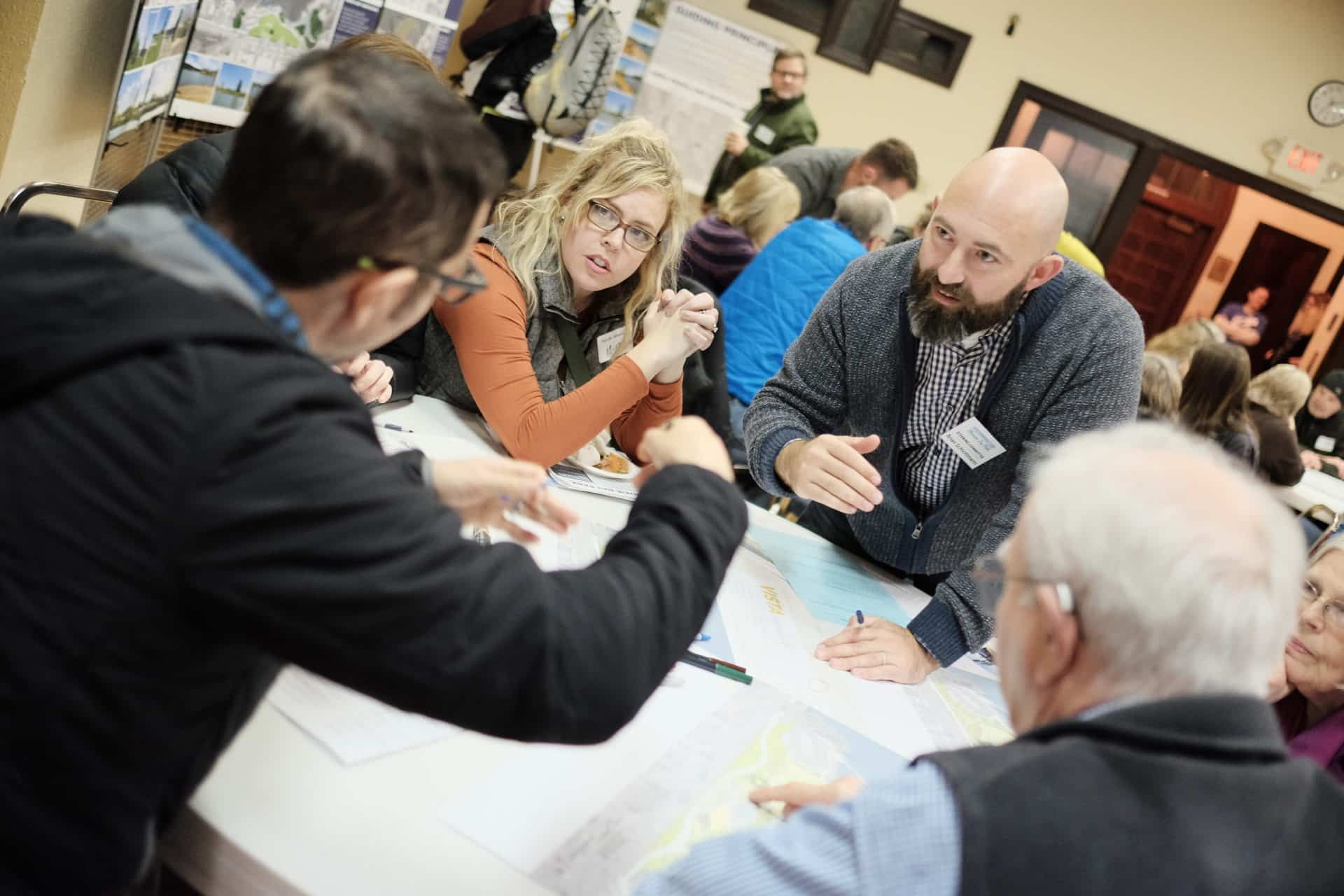 Residents around a table reviewing park plans