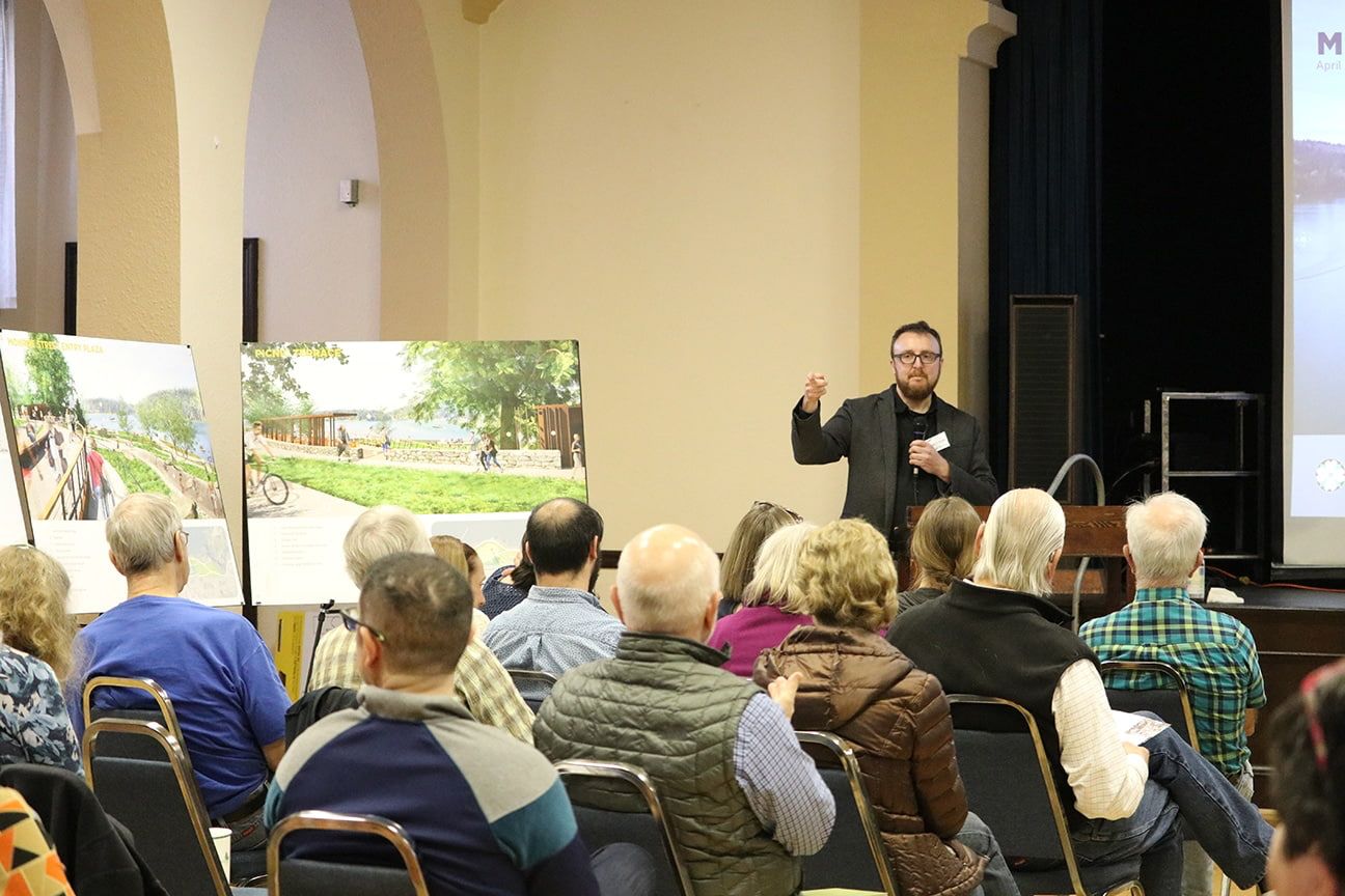 project manager speaking to crowd on park design