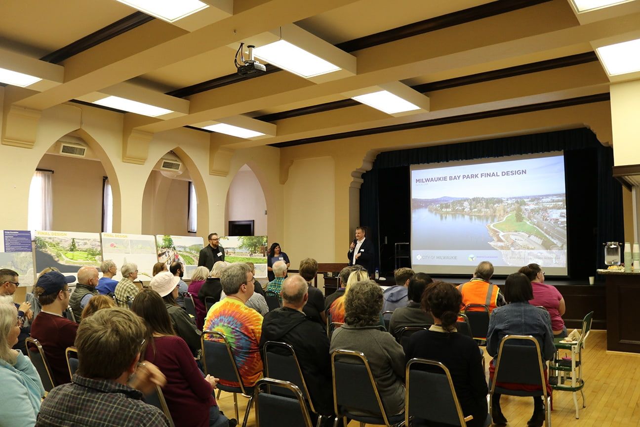 project manager speaking to crowd on park design