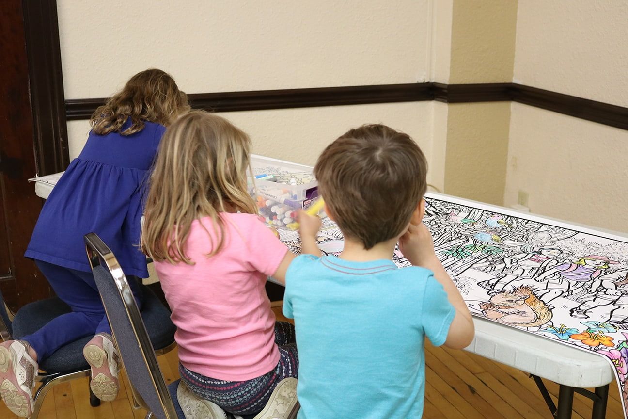 children coloring at table