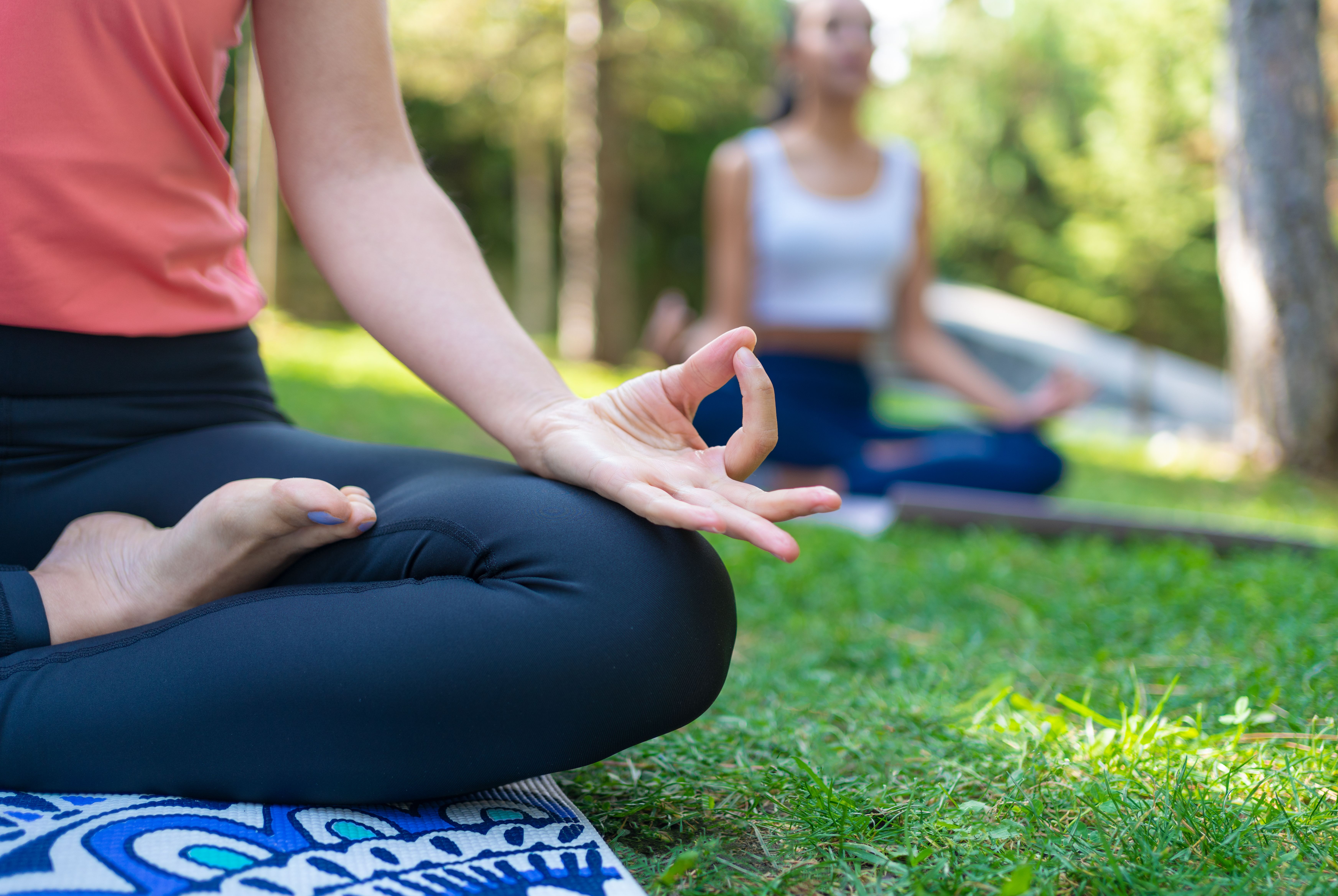 Woman meditating in park
